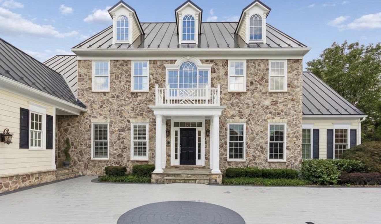 Stone colonial home photographed by KONAH Media Group